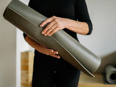 Person in a deep, passive stretch typical for Yin yoga, using props.